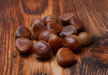 Chestnuts on wooden background