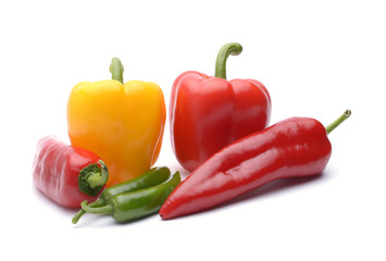 Colored peppers on white background