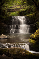 Fototapeta na wymiar Sgydau Sychryd or the Sychryd Cascades is a set of waterfalls near Pontneddfechan, south Wales.