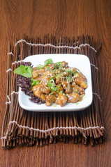 japanese cuisine. fry sauce chicken on the background