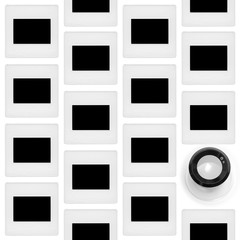 Alternating offset columns of 35mm slides with loupe. The frames are blacked out.