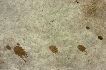 Cement floors are old and dirty.