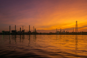 Fototapeta na wymiar Oil refinery along the river at Dusk (Bangkok, Thailand)