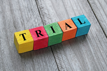 word trial on colorful wooden cubes