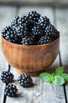 Healthy vegetarian blackberry sweet organic snack in wooden bowl