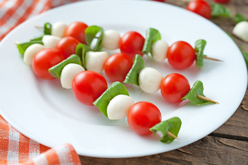 Caprese traditional mediterranean salad skewers with mozzarella