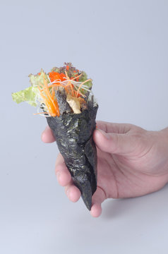japanese cuisine. hand roll on the background