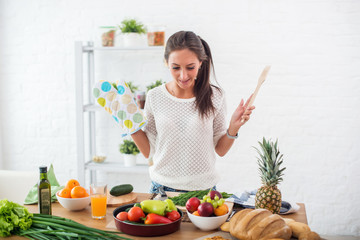 Woman preparing dinner in a kitchen concept cooking, culinary