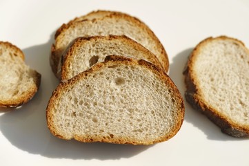 Five slices of wheat and rye baguette