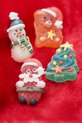 Fototapeta na wymiar Christmas sweets on red fabric