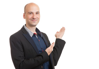 smiling bald man presenting your text or product