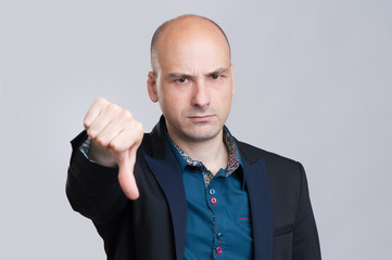 Businessman with thumb down