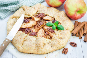 Homemade fresh apple galette with pecan nuts