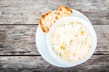 homemade soup with salmon and cream with croutons