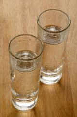 ice cold vodka on a wooden counter