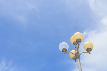 Fototapeta na wymiar Street lamps with blue sky