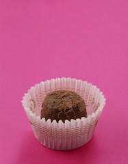 A chocolate in a paper case