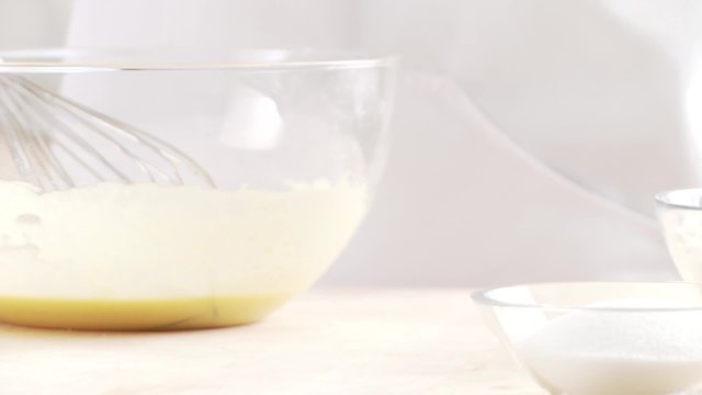Salt being added to a liquid dough