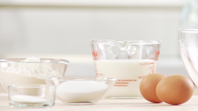 Baking ingredients: eggs, salt, sugar, flour, milk