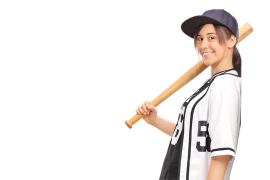 Young woman in a baseball jersey, holding a baseball bat and lea