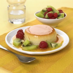 Creme caramel with kiwi fruit and raspberries