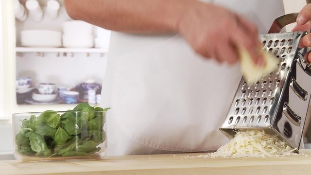 Parmesan being grated