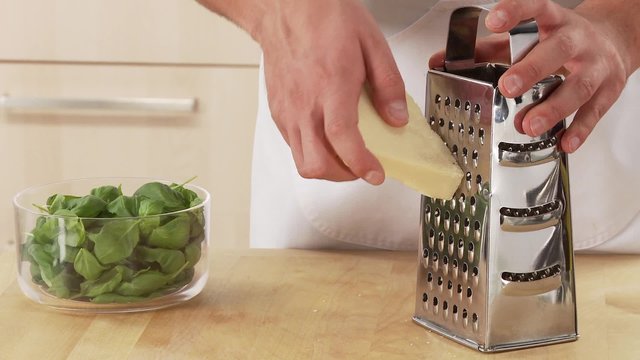 Parmesan being grated
