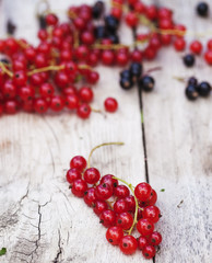 Red currant on wooden table