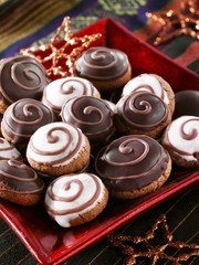 Silesian 'pepper nut' biscuits with a chocolate glaze and icing sugar