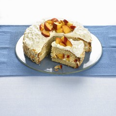 Nectarine cream cake with a piece cut
