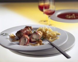Bacon-wrapped rabbit fillet with pasta