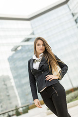 Business woman in front of office building