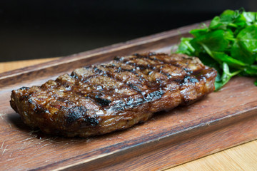 Grilled Steak on Wooden Board
