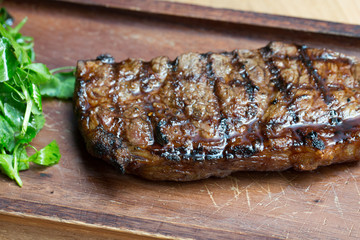 Grilled Steak on Wooden Board