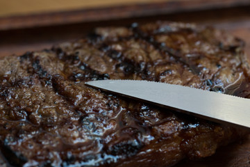 Grilled Steak on Wooden Board