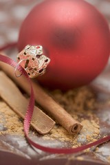 Christmas bauble and cinnamon on chocolate