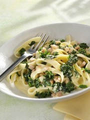 Tagliatelle with smoked turkey and kale in cream sauce