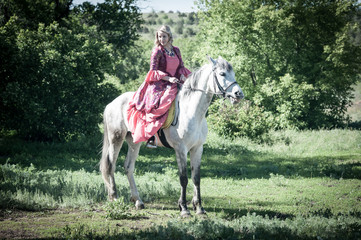 Horsewoman on white horse