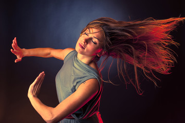 A dancer dancing and her hair flow in motion
