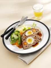 Meatloaf with vegetables and a glass of beer