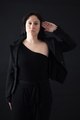 Beautiful woman doing different expressions in different sets of clothes: at attention