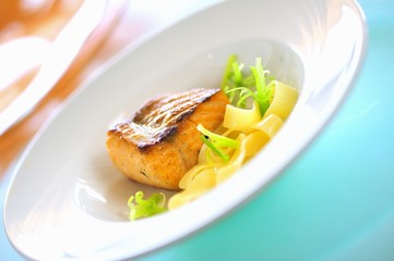 Fried salmon on fettuccine