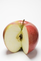 An apple, variety 'Braeburn', with a wedge removed
