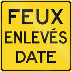 Warning road sign in Quebec, Canada - Traffic lights off by date