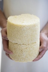 Person holding Graukäse (Grey cheese)