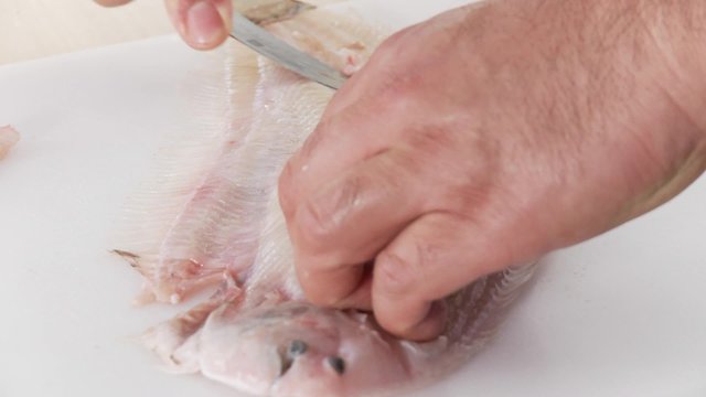 Sole being filleted