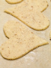 Pastry hearts on baking parchment
