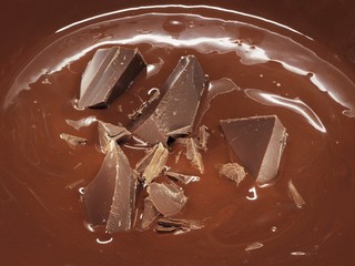 Melted chocolate with pieces of chocolate (full-frame)