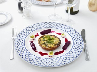 Smoked fish and spinach tart with beetroot and quails' eggs