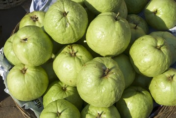 Green Asian pears on a market stall in Cambodia
